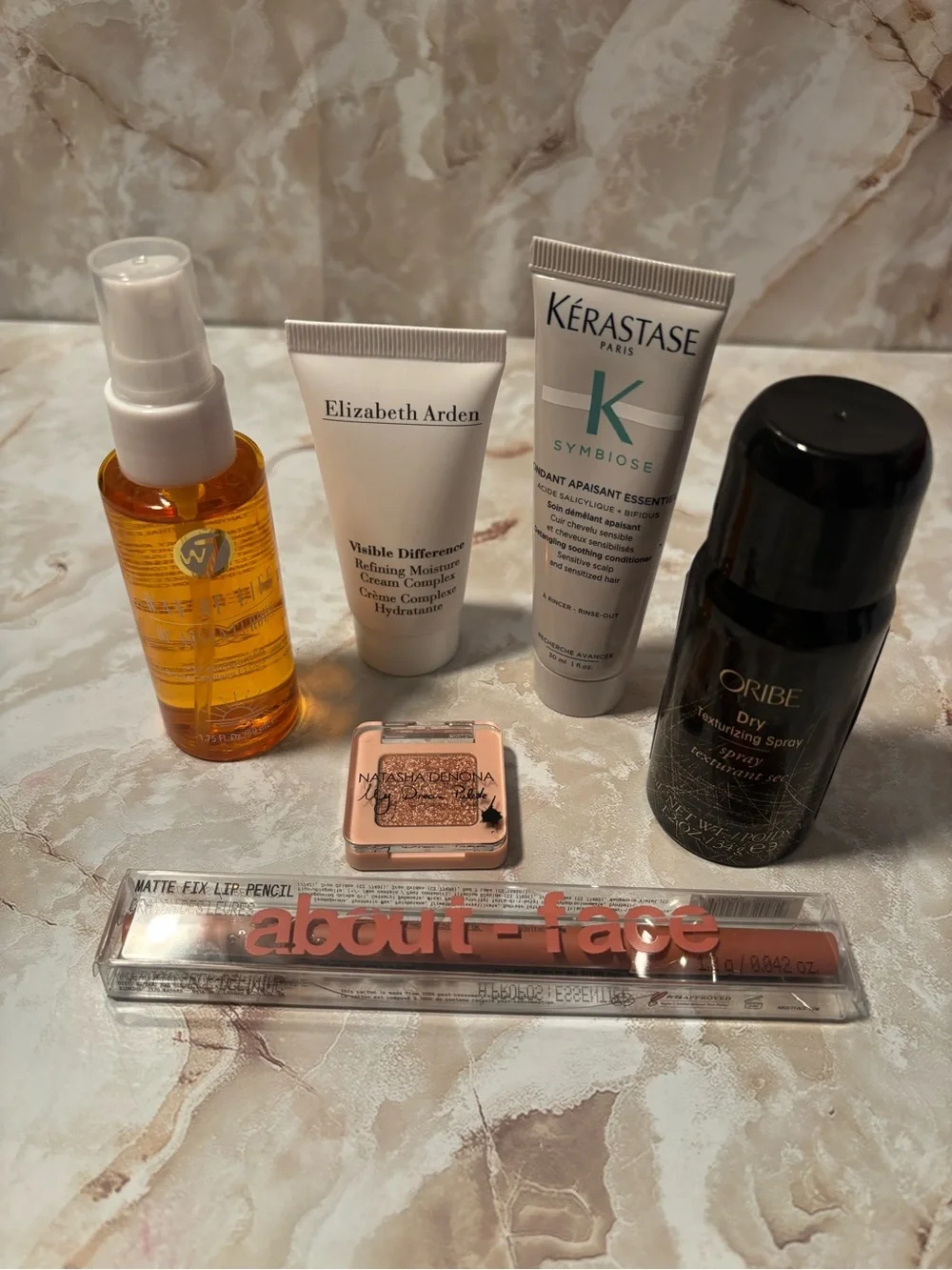 Package of various beauty items kerastase,Elizabeth Arden, oribe.